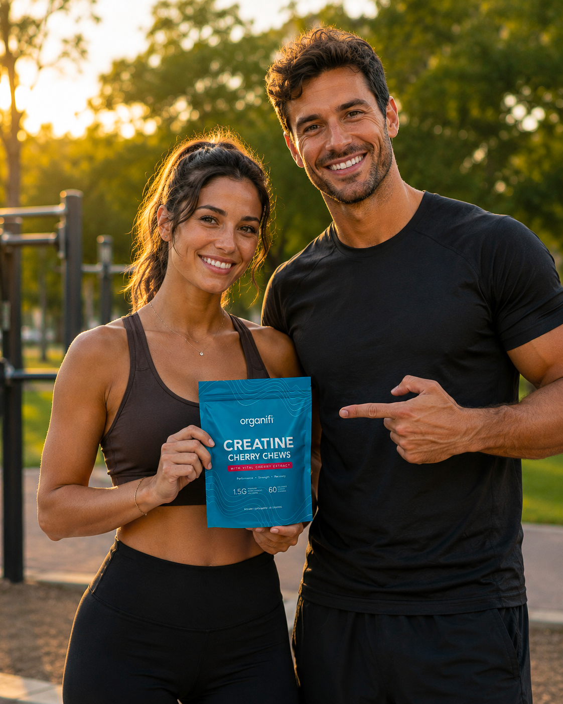 Couple holding Organifi Creatine Cherry Chews in park